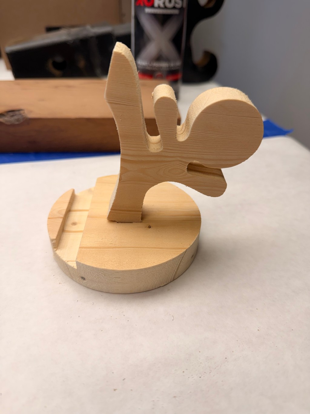 Phone stand — pine prototype on the workbench