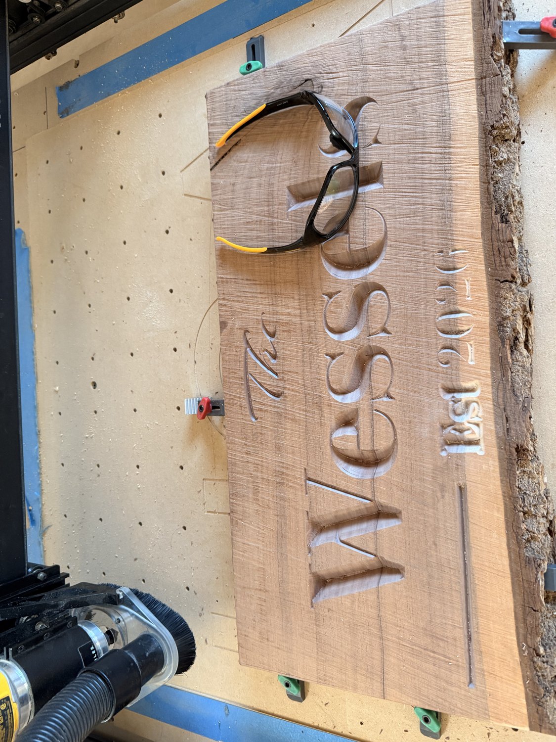 Carved family name sign